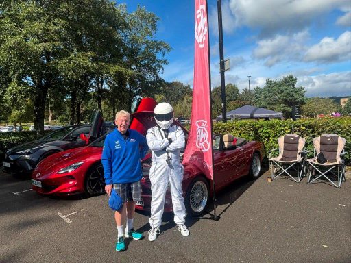 Driving legend.....meets The Stig. Committee member Billy Wait and ???